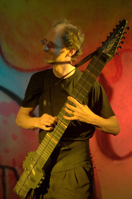 Stuart on the Cabaret Stage at DC's Artomatic 2009, playing The Master Dishwasher on his graphite Grand Stick(TM)